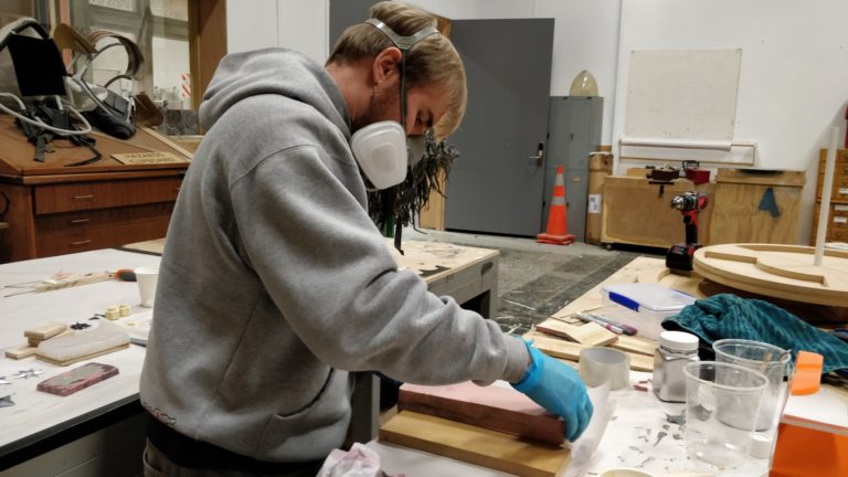 Carefully closing the mold after it's started to kick and solidify