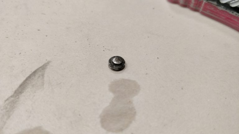 Sanded almost entirely to screw head