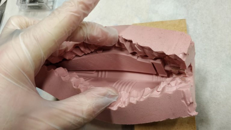 Cut mold open slowly to create a seam line for pulling out future casts