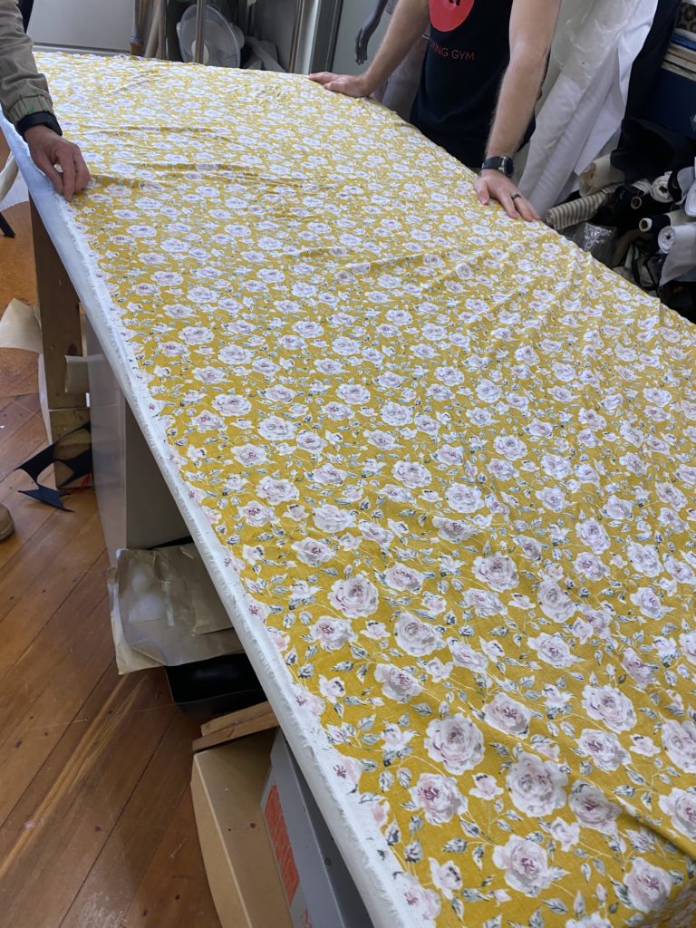 Fabric being cut to size