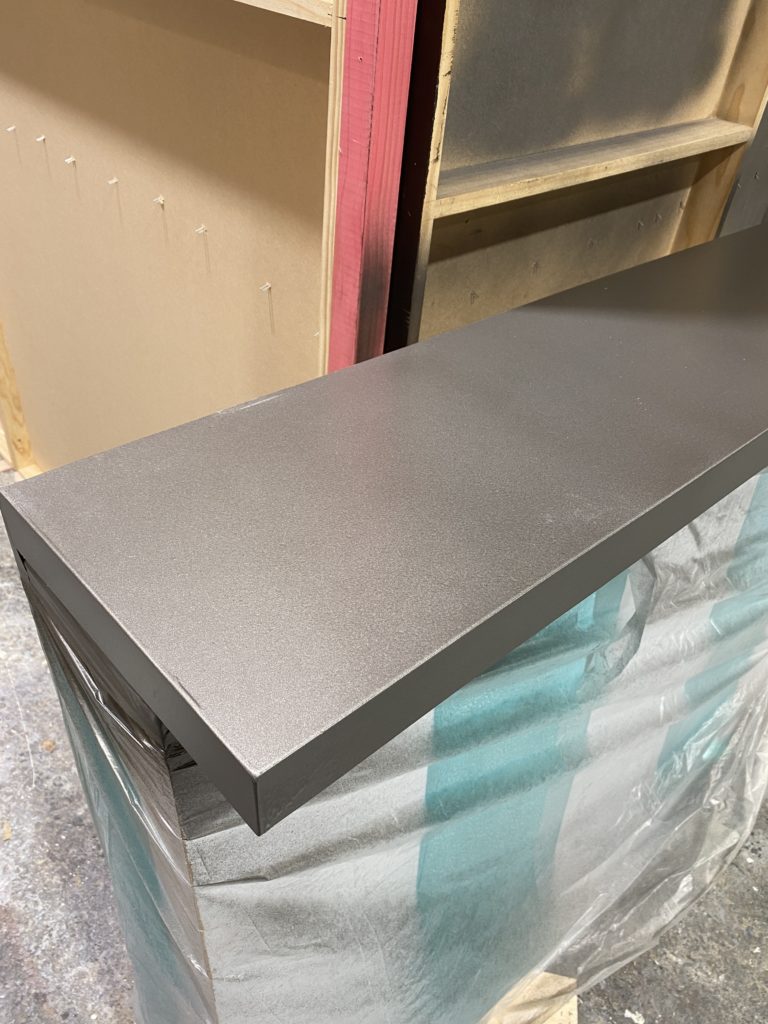 Faux metal surface of Tulsey bench