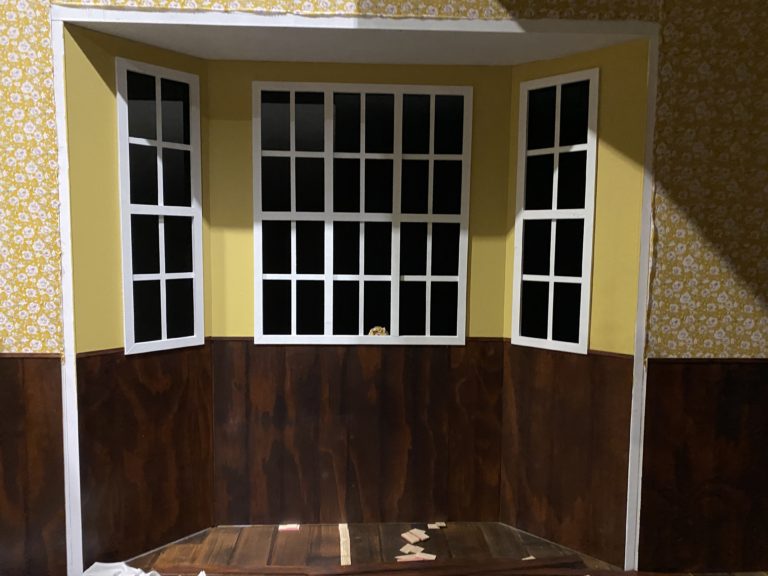 Wood paneling cut and attached under bay window