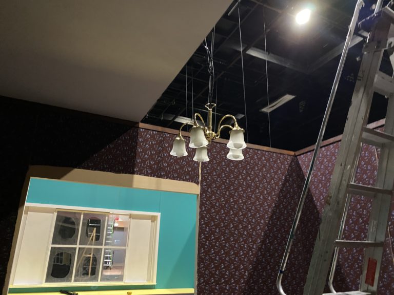 Ceiling and chandelier over dinning room